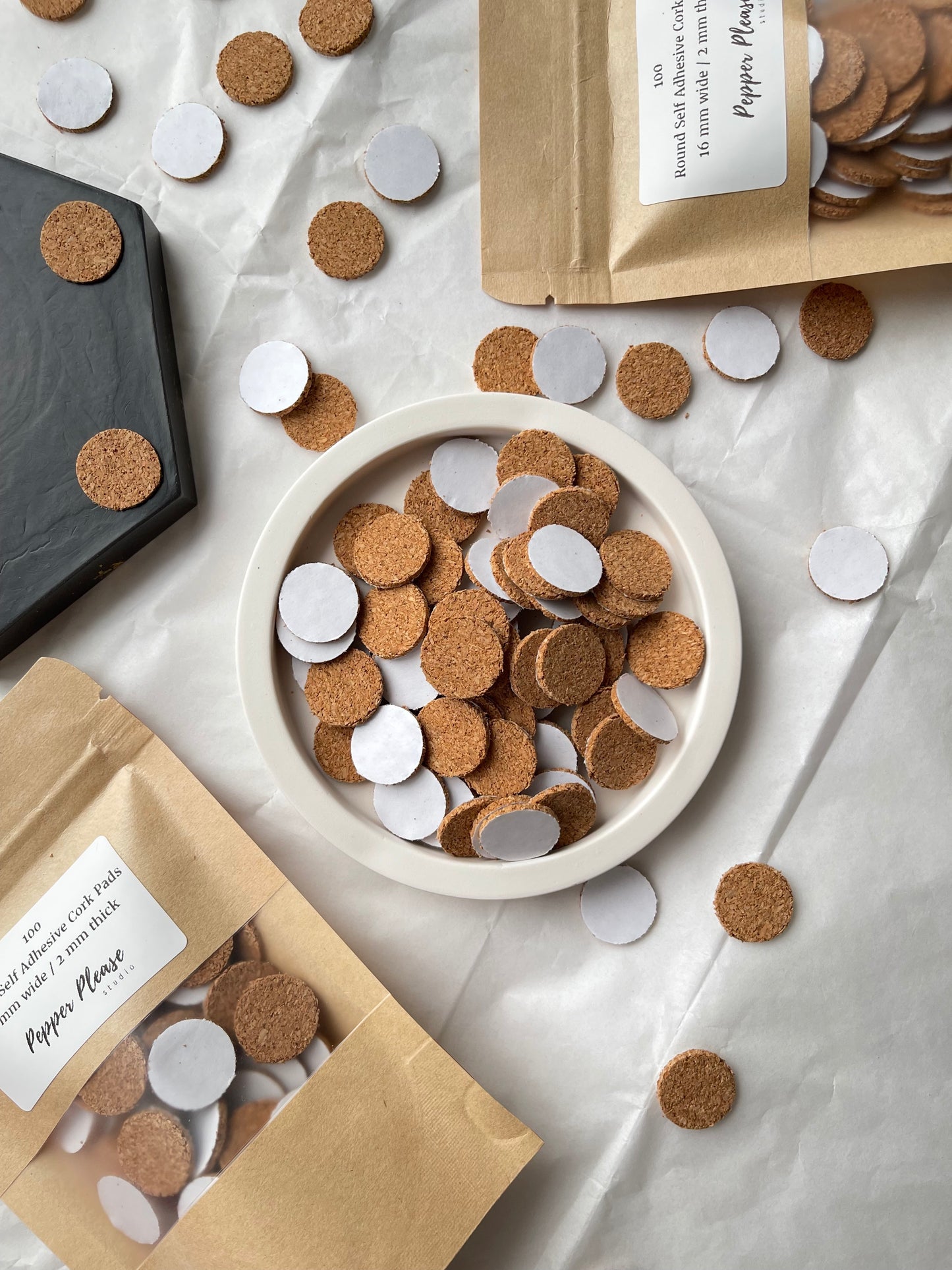 Self-adhesive round cork pads
