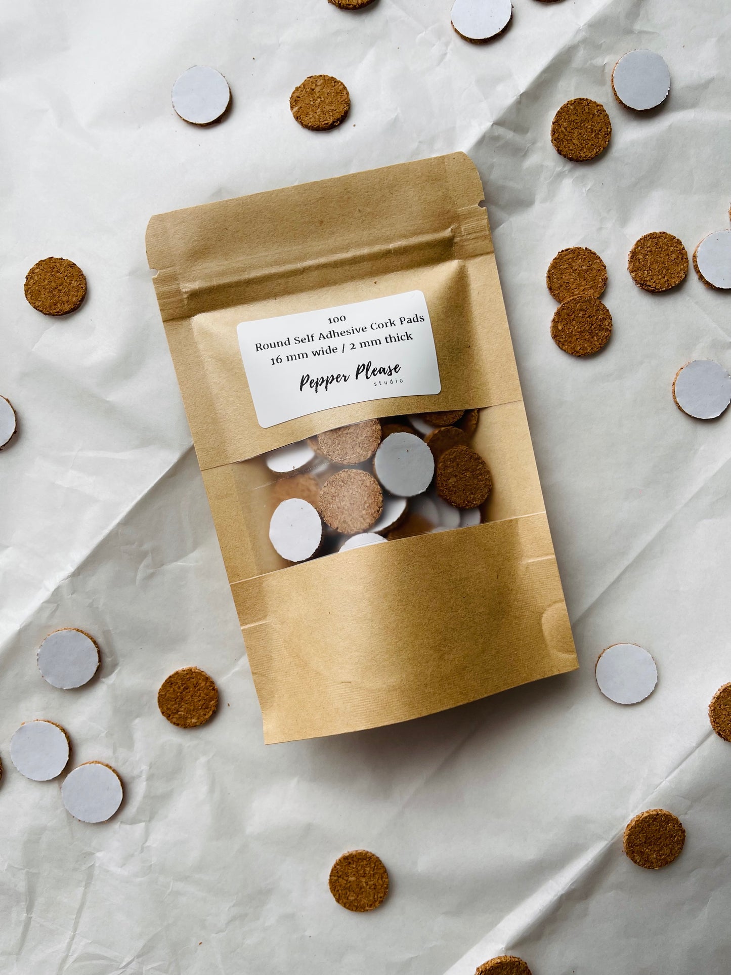 Self-adhesive round cork pads